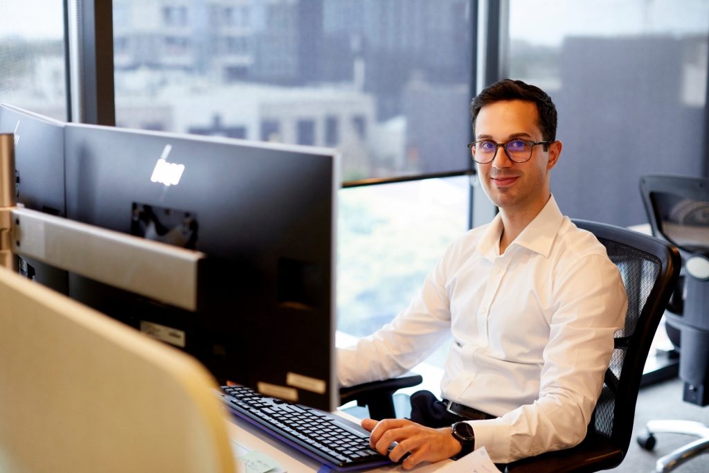 man doing work by a computer